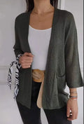 Women's army green waffle texture cardigan coat with nine-quarter sleeves and pockets on a hanger.