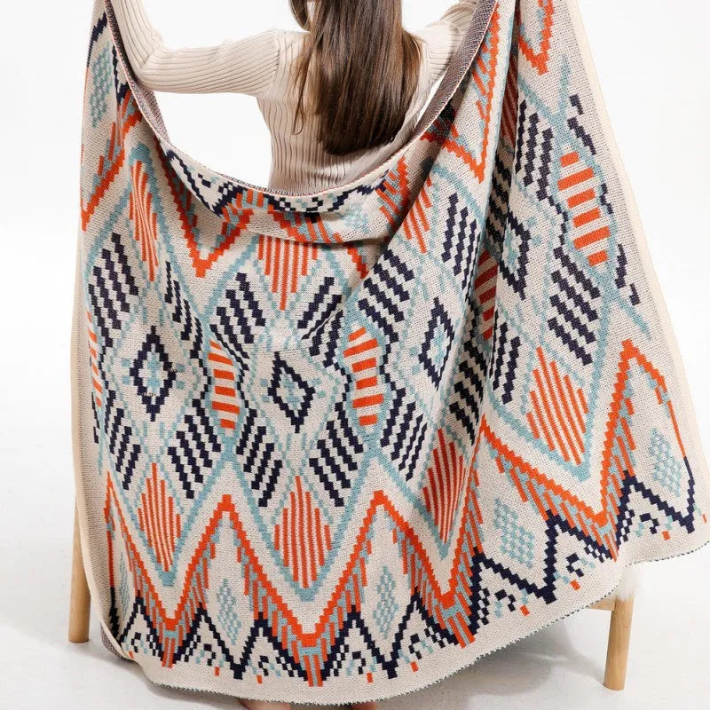 Bohemian-style acrylic sofa cover blanket with tassel trim in a geometric pattern colour option