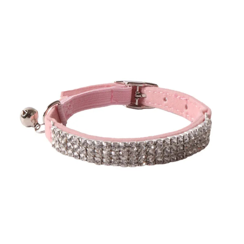 Soft flocking elastic buckle cat collar in multiple colours on a white background.