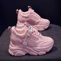 Women's black mesh platform casual shoes with a hollow-out toe holder design on a white background.