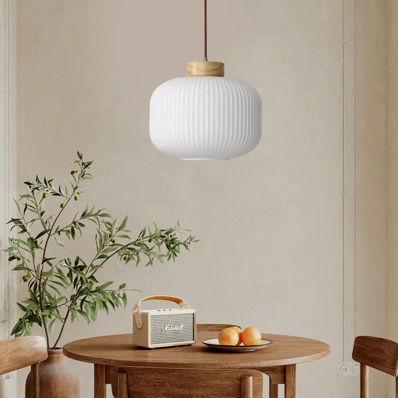 Retro Nordic style wooden pendant ceiling light with a choice of three sizes and three light colours.