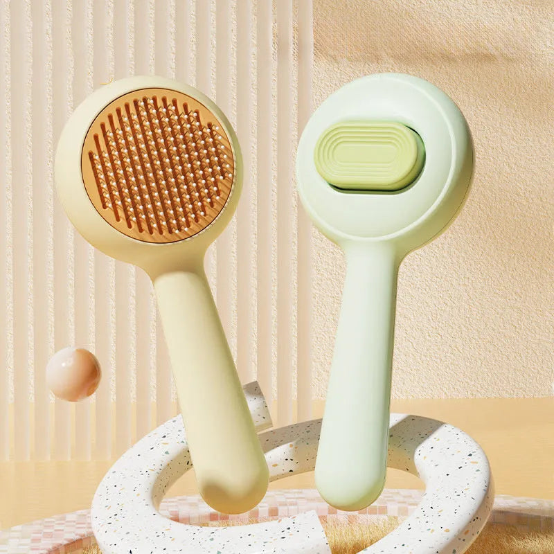 Stainless steel cat grooming brush with non-slip plastic handle in green or yellow colour