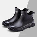Short tube PVC wading shoes with a round toe and non-slip plastic sole on a flat heel.