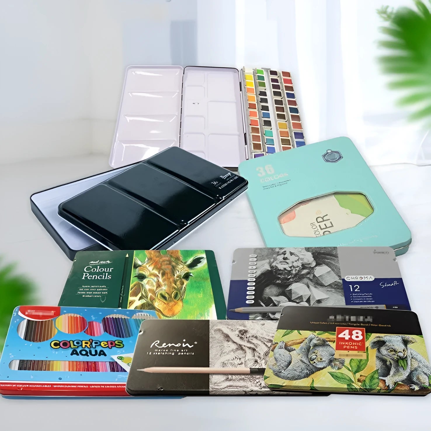 Three-fold tinplate watercolour paint box showing folding mechanism and square shape