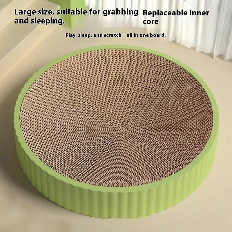 Round green cat scratching board and nest with replaceable corrugated cardboard surface, 55 cm diameter.