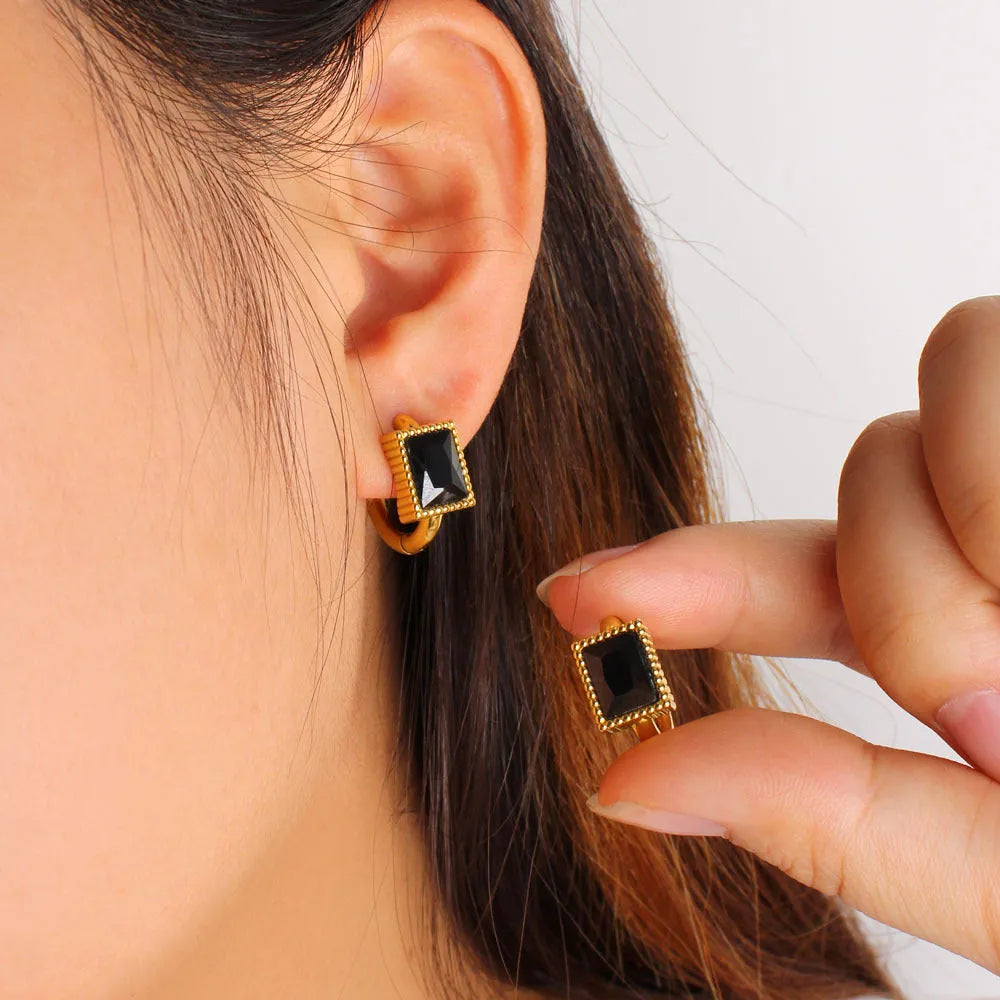 Square geometric zircon earrings with round ring details on stainless steel.