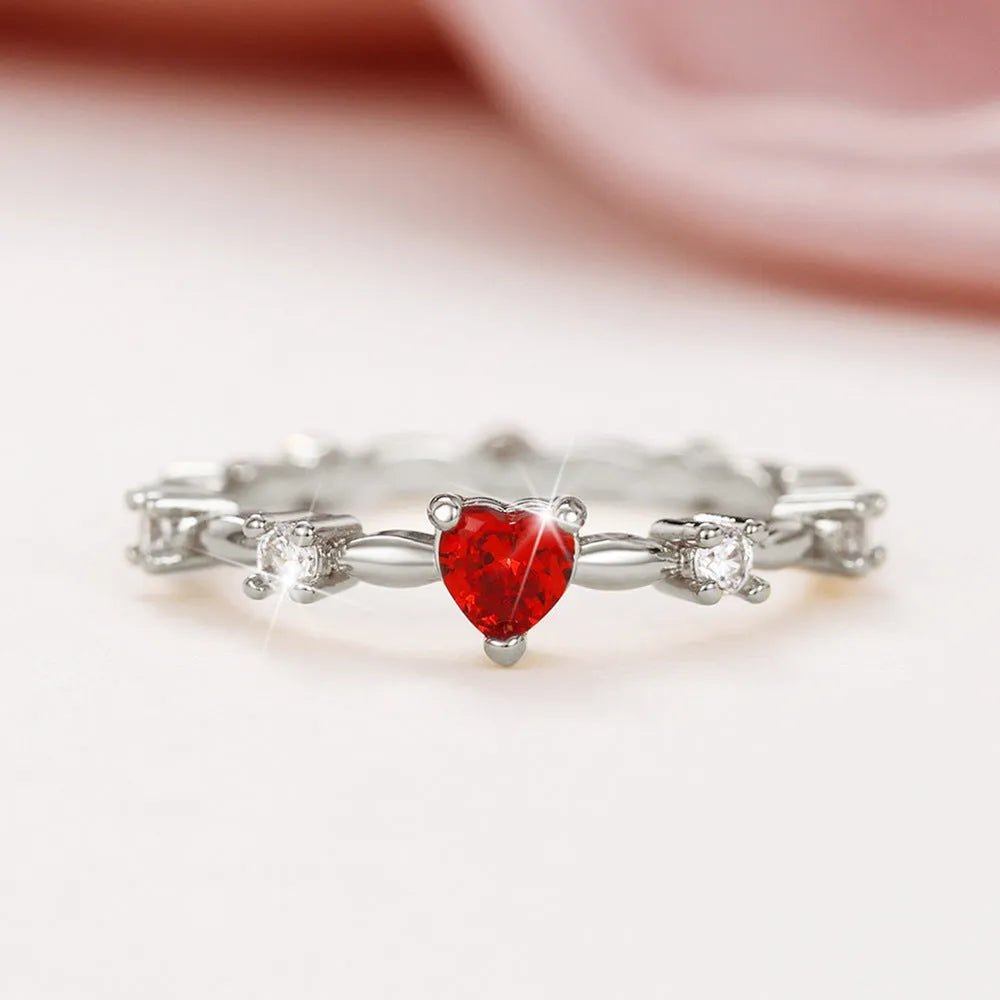 Zircon peach heart ring in gold or silver electroplated finish on copper, shown in UK sizes 6-10