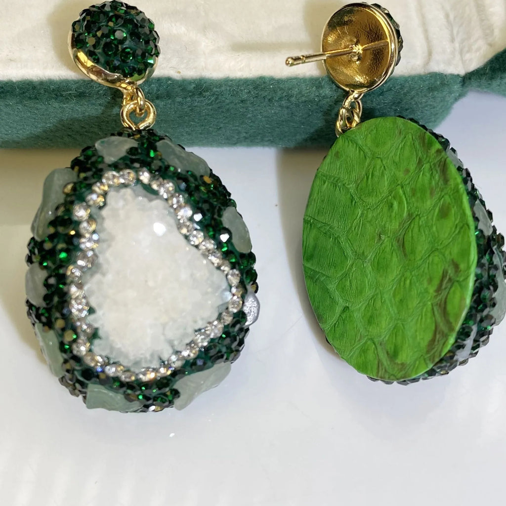 Crystal Bud Inlaid Emerald Earrings in dark green with a copper geometric base and crystal bud detail on a white background