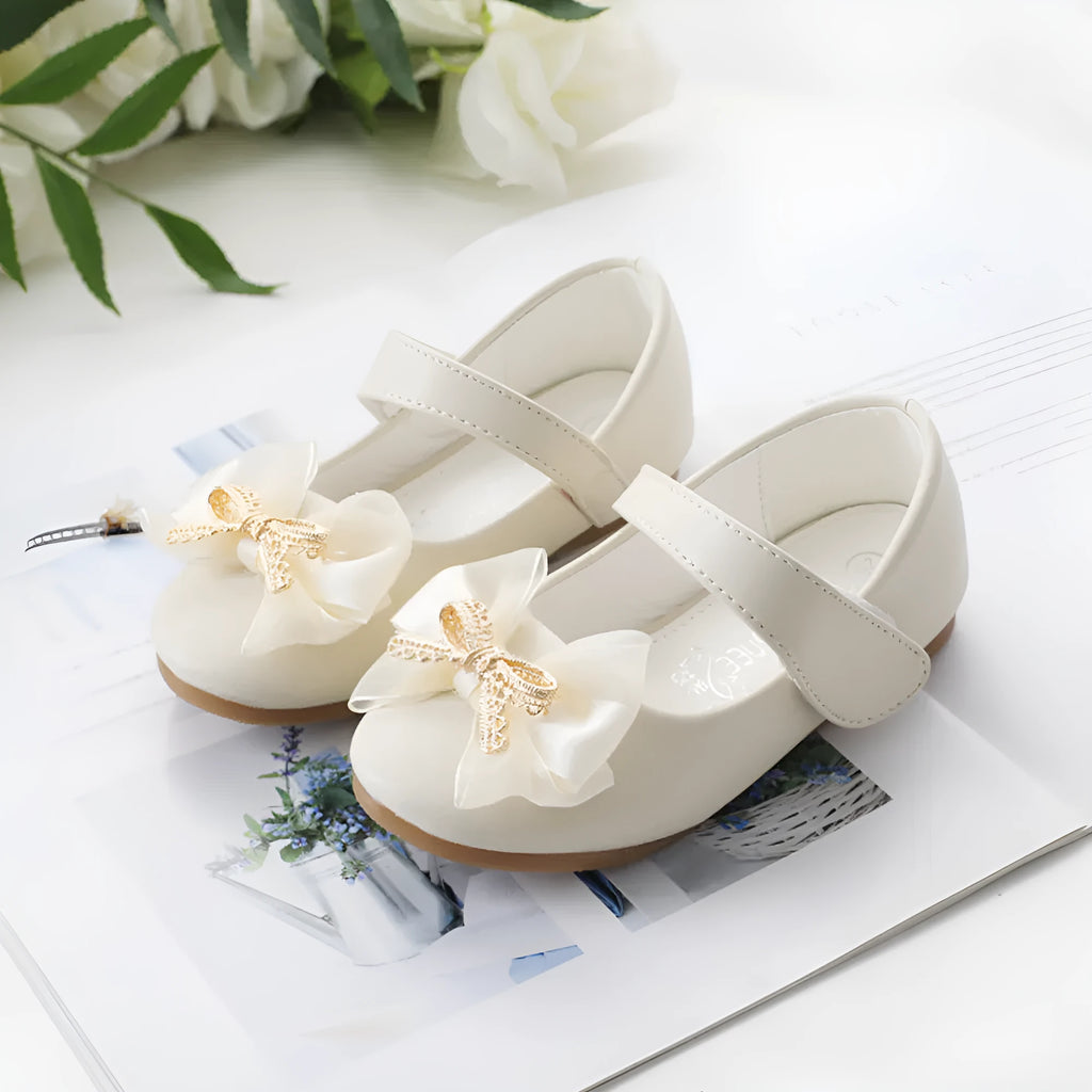 Bowknot PU leather children's shoes with Velcro closure and beef tendon sole, available in pink, beige, gray, and black, sizes 19-35.