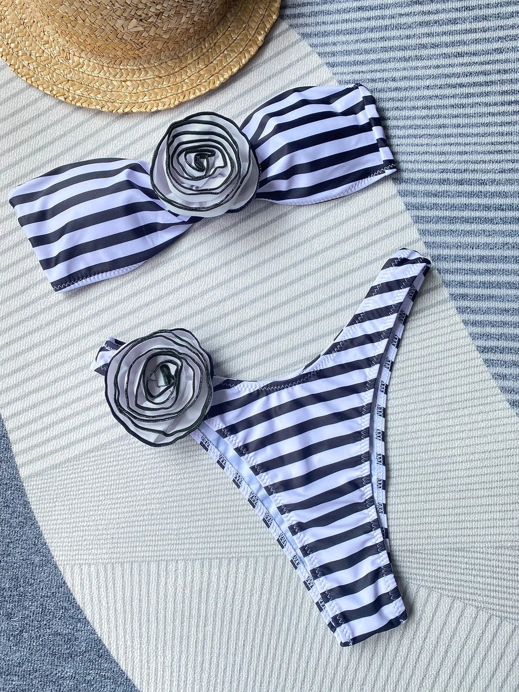 Striped bikini swimsuit with three-dimensional floral split design showing tube top and briefs