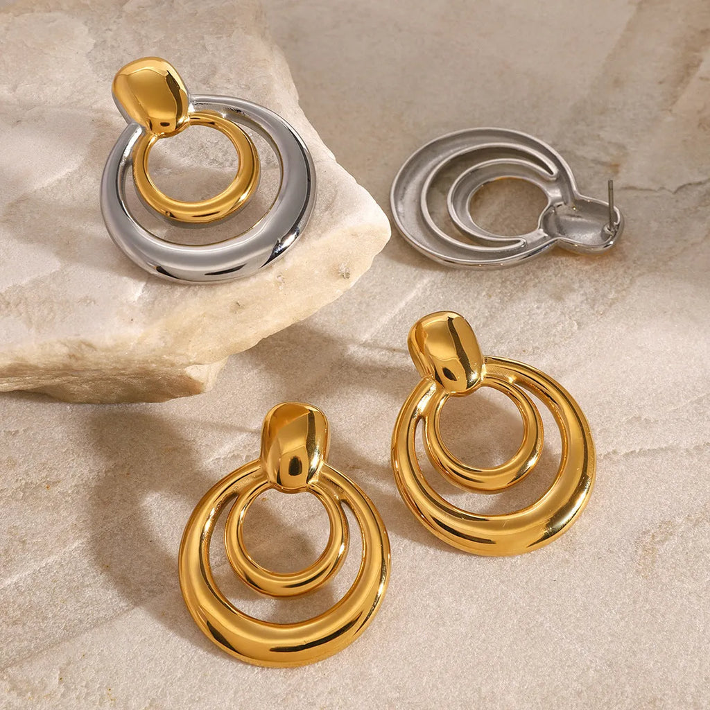 Golden round geometric stud earrings with double layer hollow design on titanium steel
