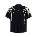Black loose fit T-shirt with rivet ribbon padded shoulders, short sleeves, round neck