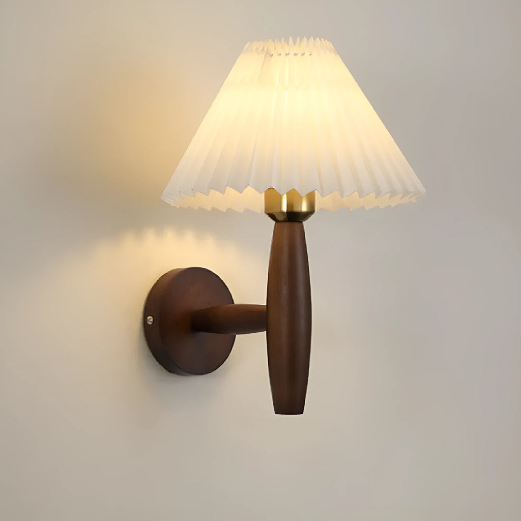 American retro-style wooden wall lamp with a fabric shade in a walnut finish on a bedroom wall.