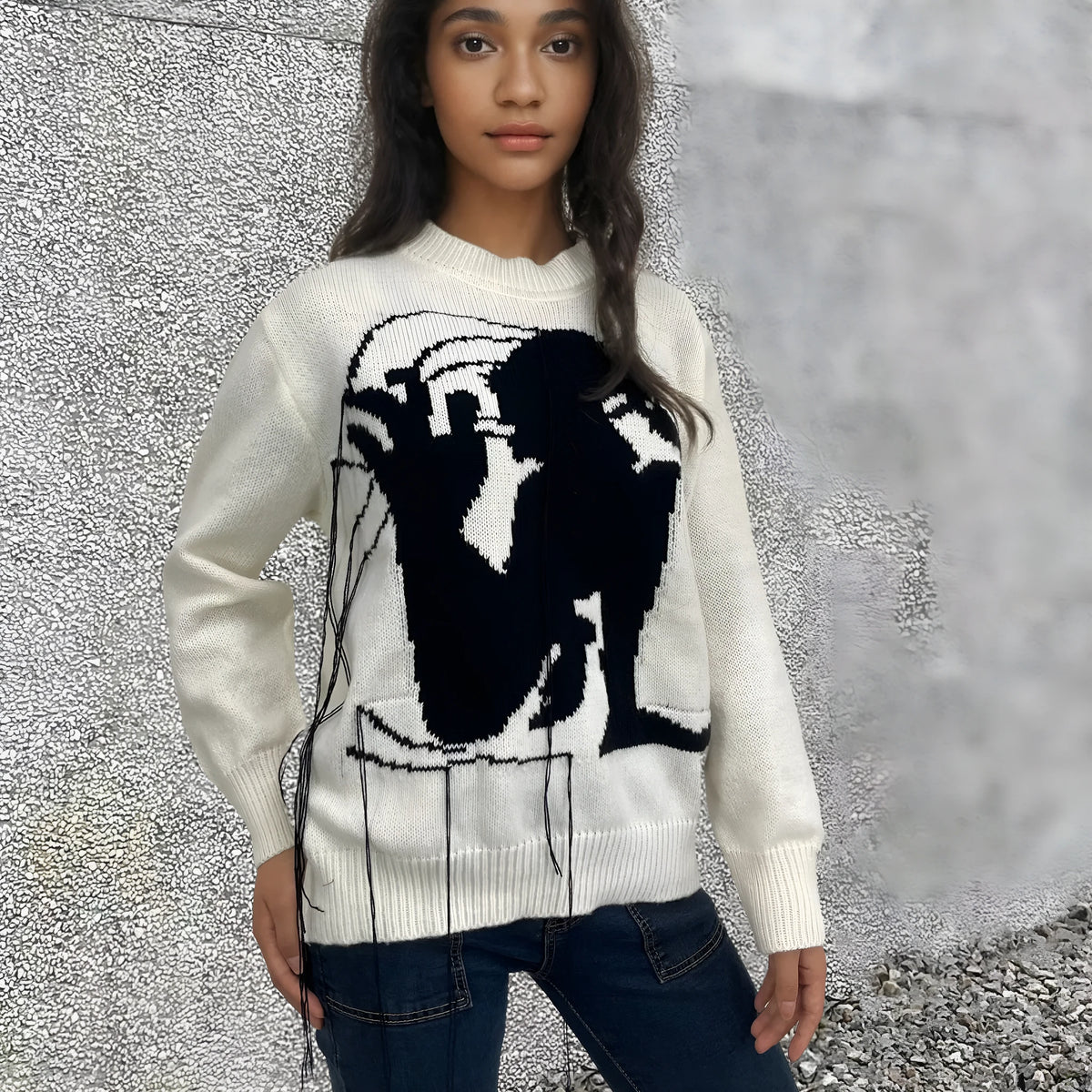 Women's loose fit alpaca wool sweater with tassel details and abstract pattern in street fashion style