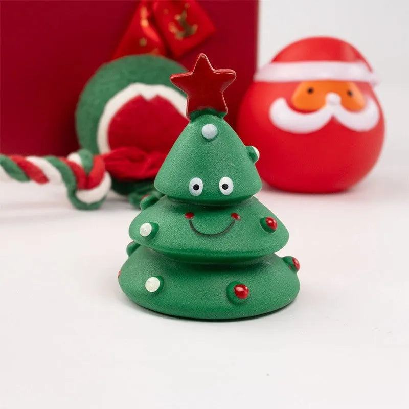 Seven sets of colourful vinyl Christmas dog toys including barbells, balls, bite ropes, and Santa Claus figures