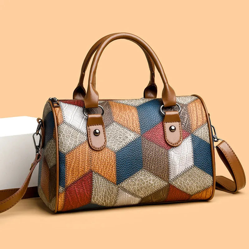 Cylinder crossbody shoulder bag in black or brown PU with plaid geometric pattern and single strap