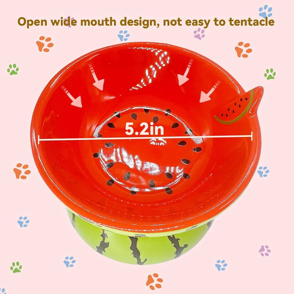 Ceramic tilted and elevated cat food bowl in orange pattern with non-slip base.