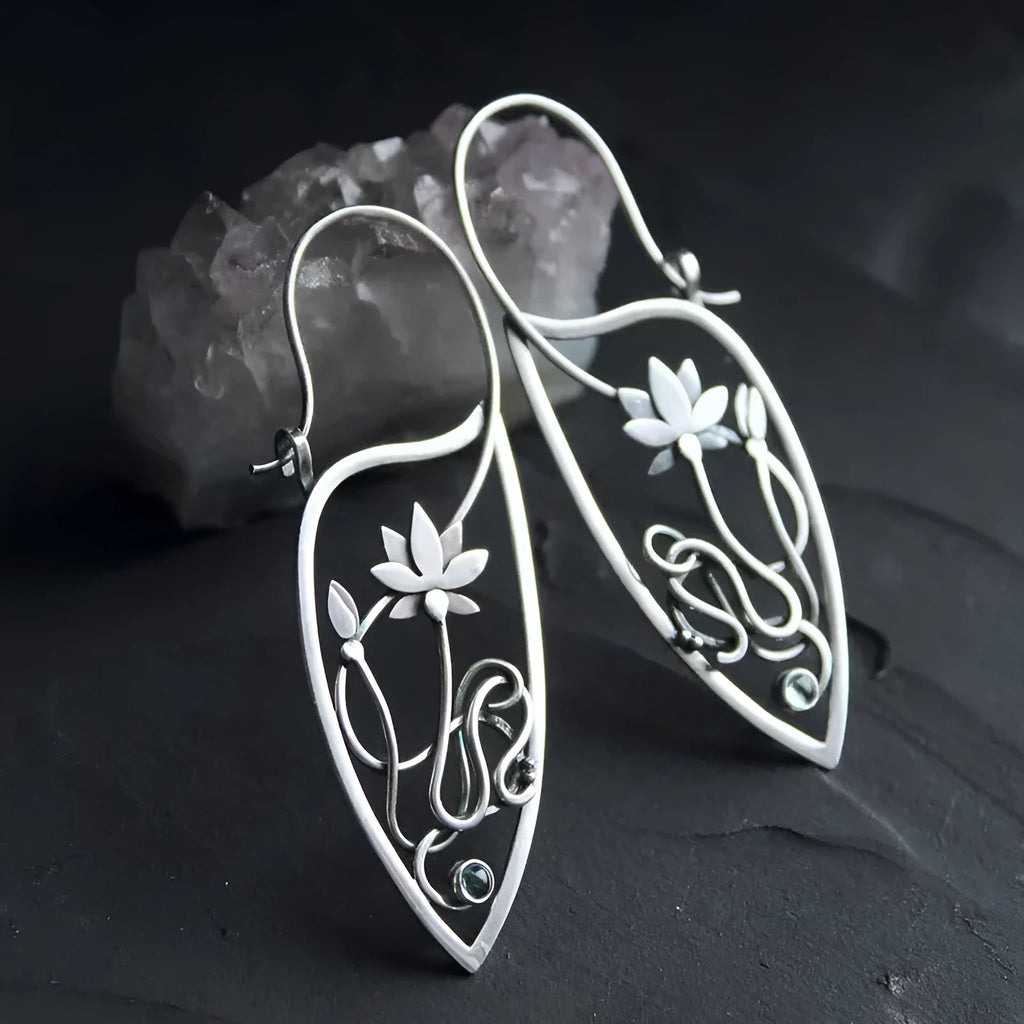 Silver lotus vine and geometric flower design earrings with rhinestone decoration on alloy base