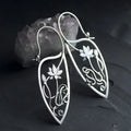Silver lotus vine and geometric flower design earrings with rhinestone decoration on alloy base