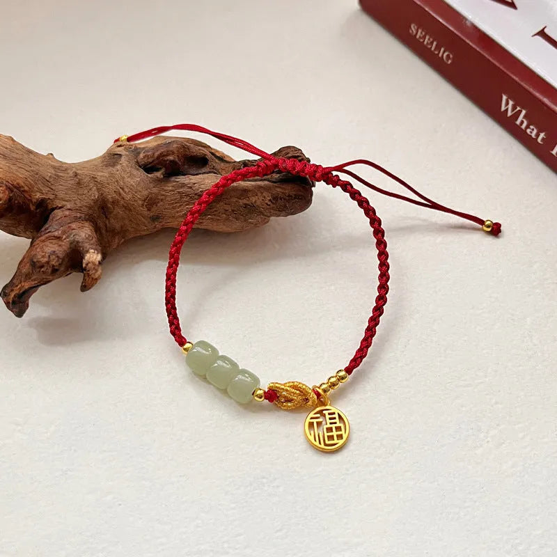 Red rope woven bracelet with copper-plated gold blessing card strap and Chinese character modelling for women.