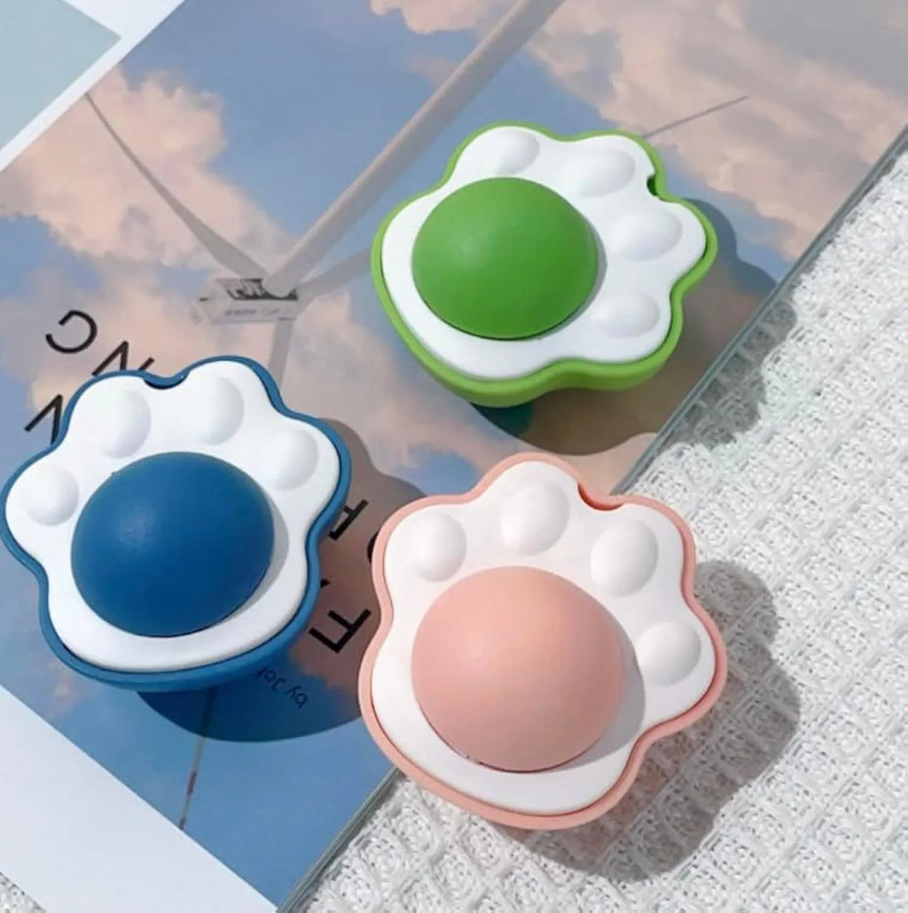 Four assorted coloured catnip balls for feline dental care and interactive play