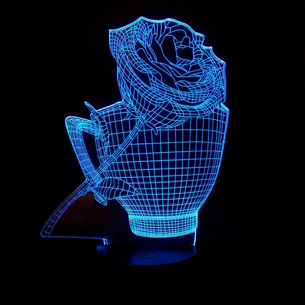 3D acrylic rose flower night light with remote control on a table, displaying purple light.