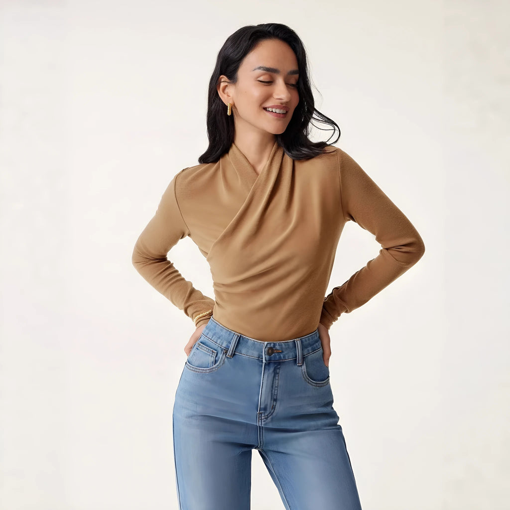 Camel-colour women's slim fit long sleeve pullover sweater on a hanger