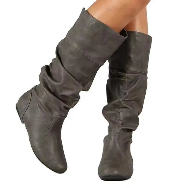 Women's flat heel long slip-on boots in black with round toe and high cylinder design