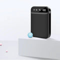 Mini power bank in plastic shell with multiple USB ports showing black, blue, pink, and white colour options