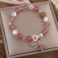 Women's double-layer strawberry quartz crystal bracelet with a Lucky Cat charm in red cat's eye flowers colour.