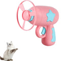 Blue plastic interactive cat toy gun with a mounted pink Frisbee on a table.