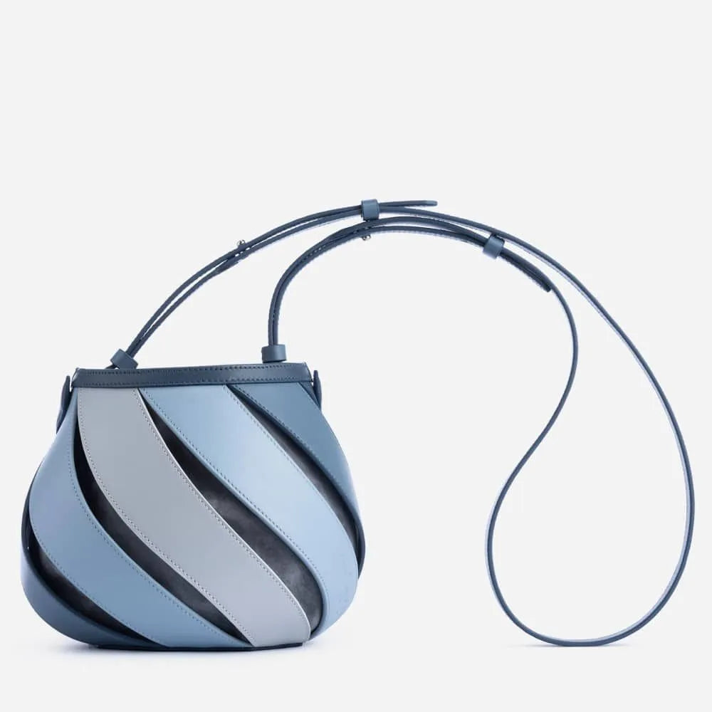 Cylindrical diamond quilted bucket bag in beige with contrast stitching