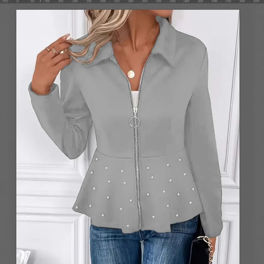 Women's loose fit black coat with beaded heavy-duty zipper and ruffled hem detail.