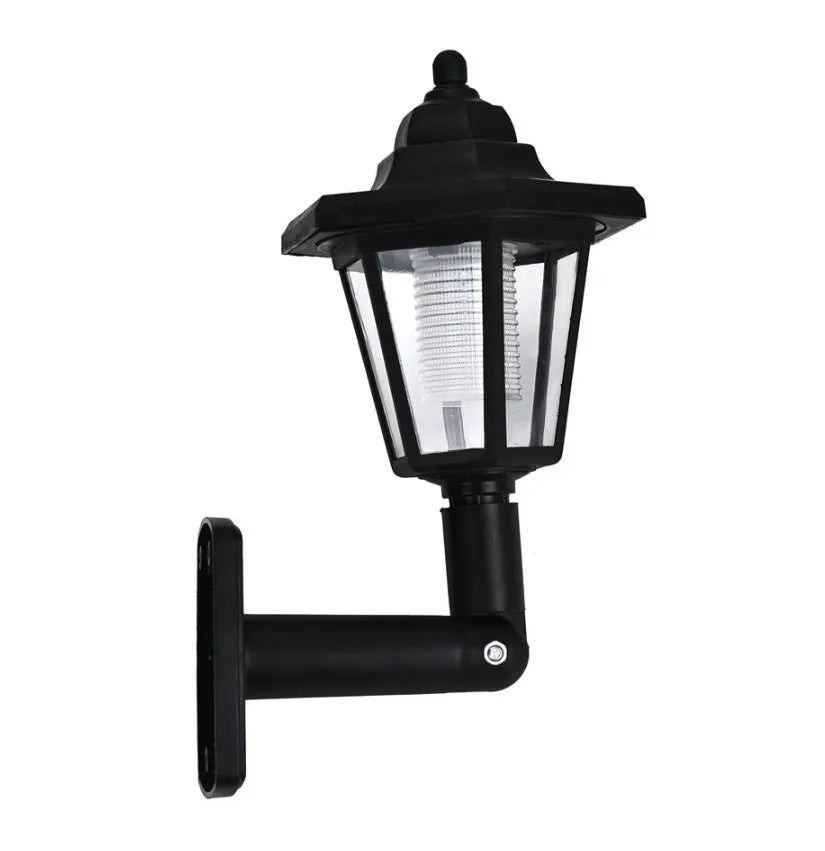 Black hexagonal solar-powered outdoor wall light with visible solar panel.
