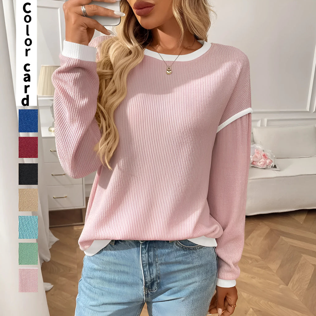 Women's loose fit round neck long sleeve pullover top in light blue polyester fabric.