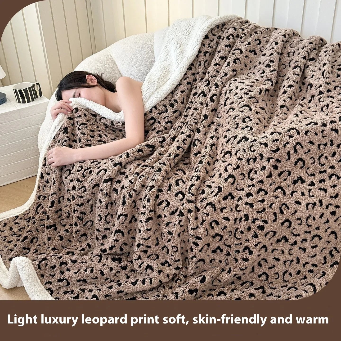 Double-layer taffeta blanket with reversible leopard jacquard print design shown in camel colour