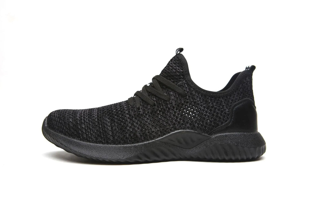 Black work safety shoe with steel toe cap and EVA sole on a grey background