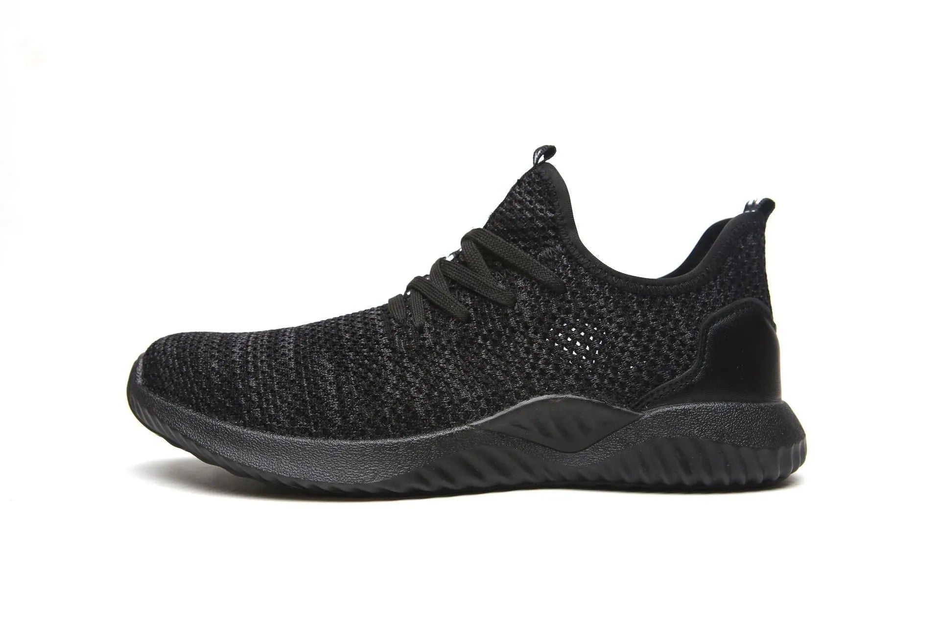Black work safety shoe with steel toe cap and EVA sole on a grey background