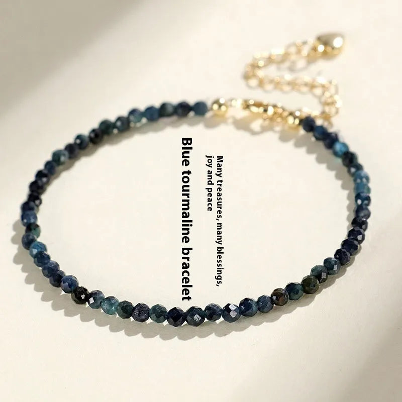Close-up of a blue tourmaline and spacer bead bracelet for women.