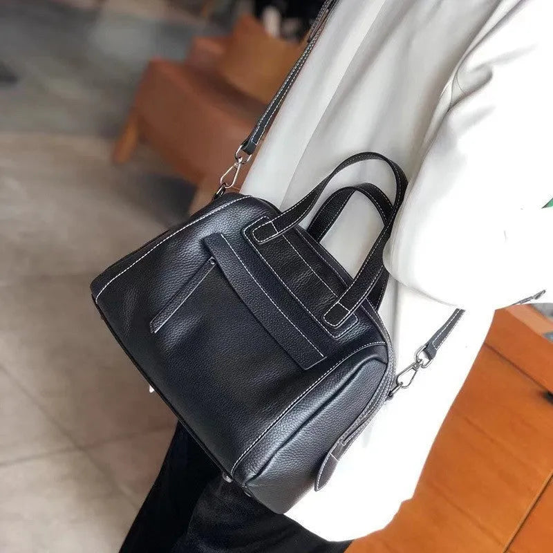 Men's horizontal square leather messenger bag with litchi pattern, shown in elephant grey with shoulder strap.