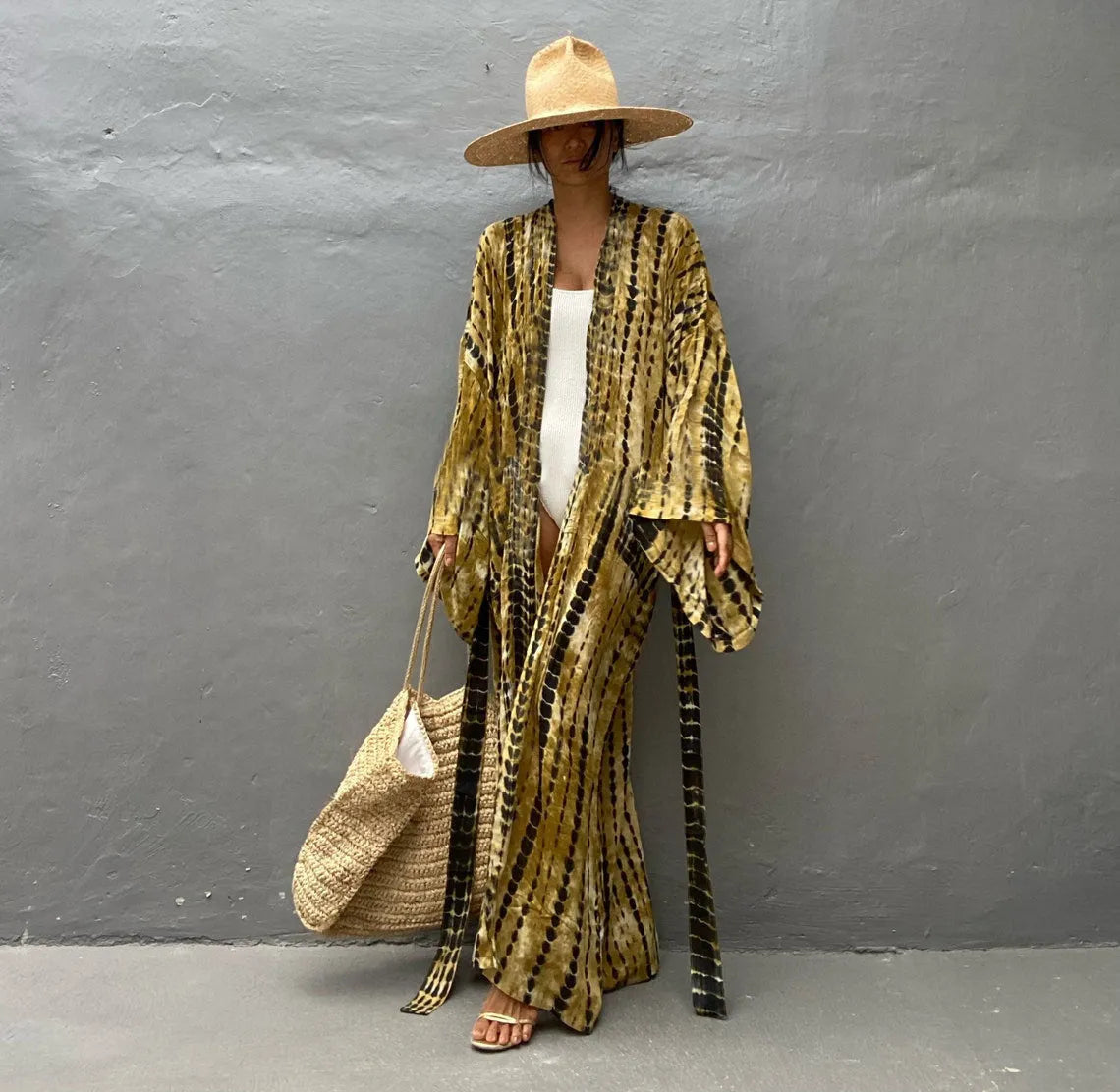 A printed, loose-fitting cotton beach cover-up blouse on a hanger, shown in a rust red colour from the DN0712 series.