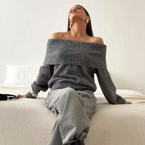 Grey off-the-shoulder strapless sweater with a raised 3D pattern texture.