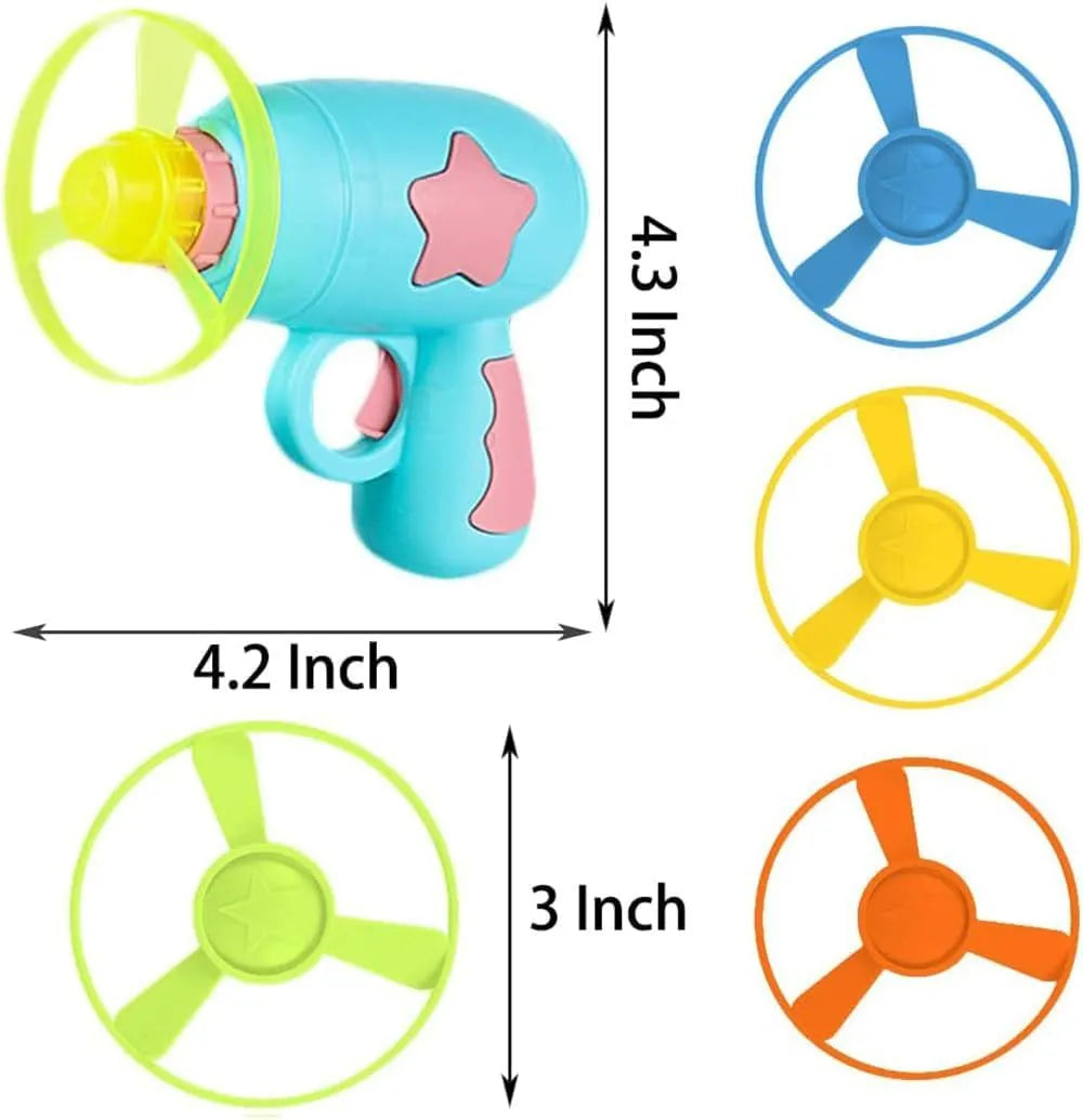 Blue plastic interactive cat toy gun with a mounted pink Frisbee on a table.