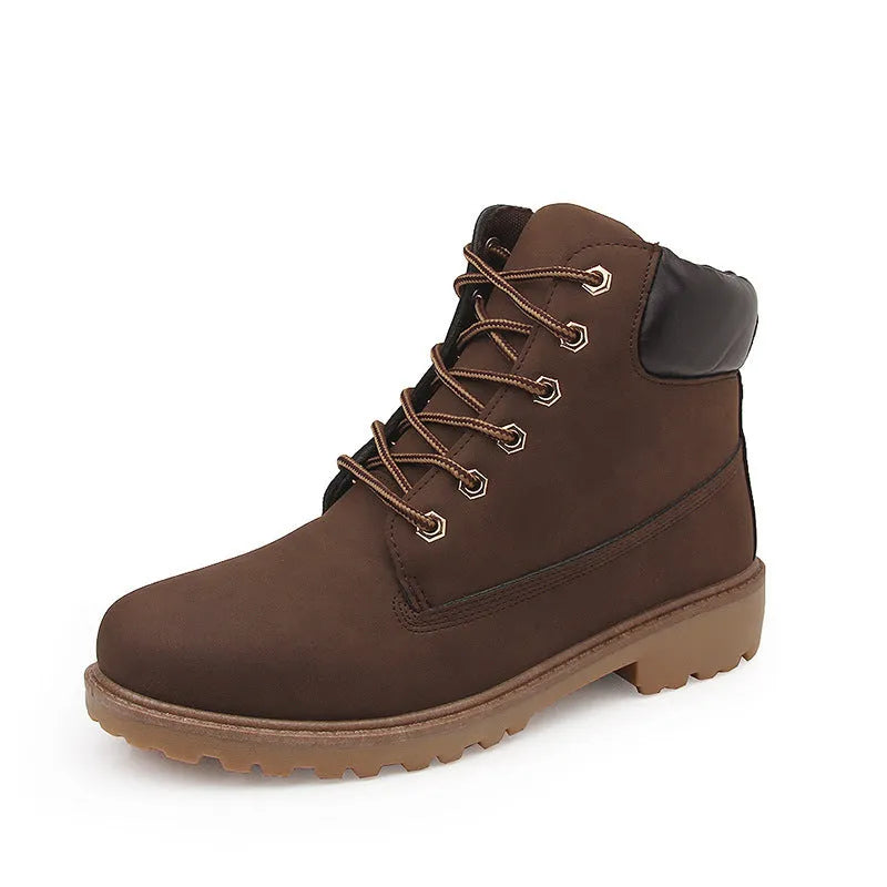 Pink high-top Martin boots with velvet lining, round toe, and front lace-up closure on a flat sole.