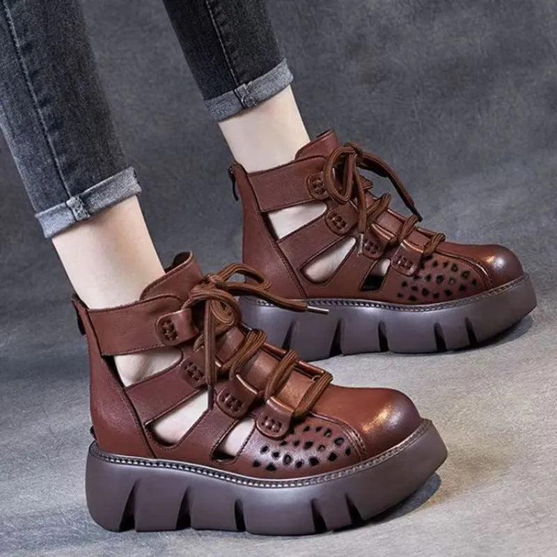 Women's black platform sandals with a hollow-hole leather upper and fish-mouth toe.