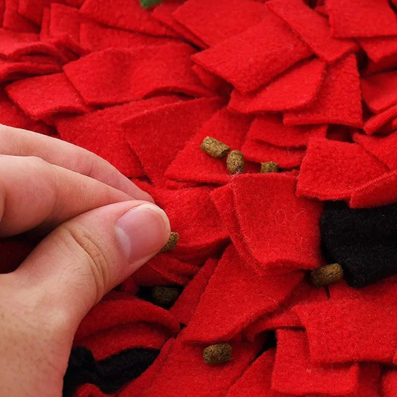 Red and green strawberry-shaped pet slow feeder mat with textured hiding spots