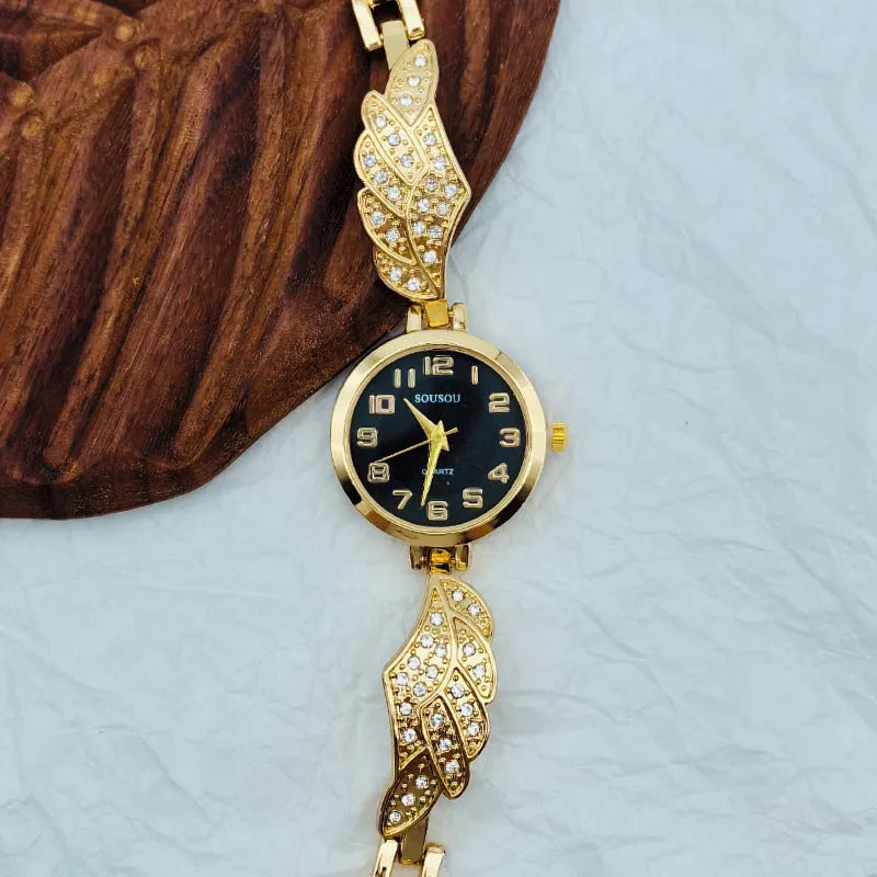 Round stainless steel women's watch with gold dial surface and Vachette clasp buckle