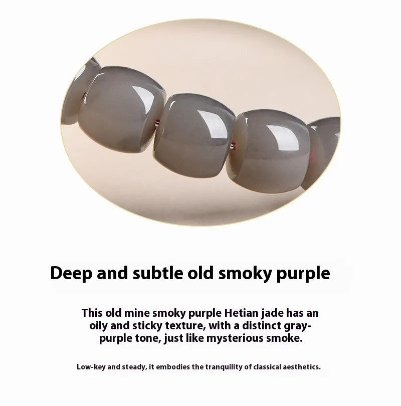 Natural smokey violet Hetian jade straight cut bracelet on a wrist.