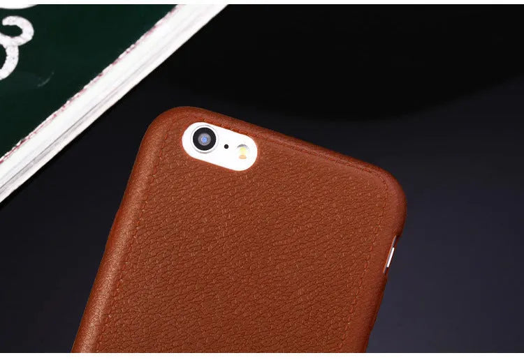 Leather phone case with TPU construction for iPhone, available in black, brown, navy blue and wine red.