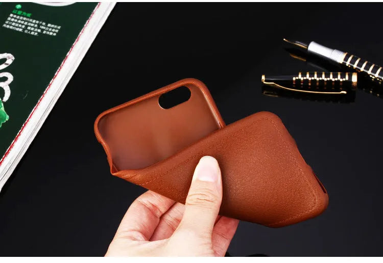 Leather phone case with TPU construction for iPhone, available in black, brown, navy blue and wine red.